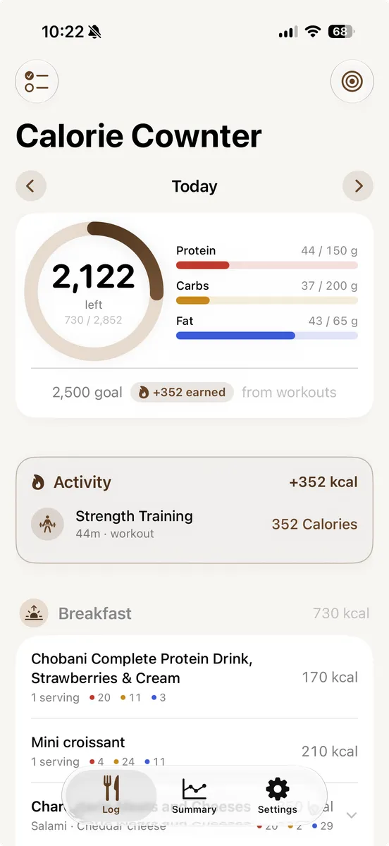 The Calorie Cownter home screen: 2,122 calories left of a 2,852 budget, protein, carbs and fat bars, a strength-training workout that earned 352 calories back, and a logged breakfast.