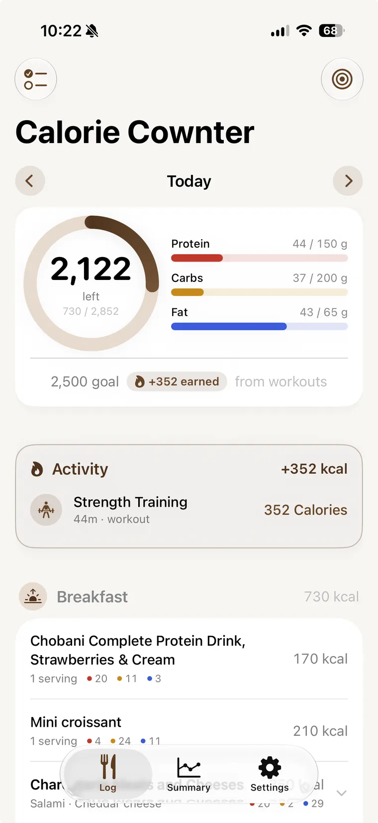 The Calorie Cownter home screen: 2,122 calories left of a 2,852 budget, protein, carbs and fat bars, a strength-training workout that earned 352 calories back, and a logged breakfast.